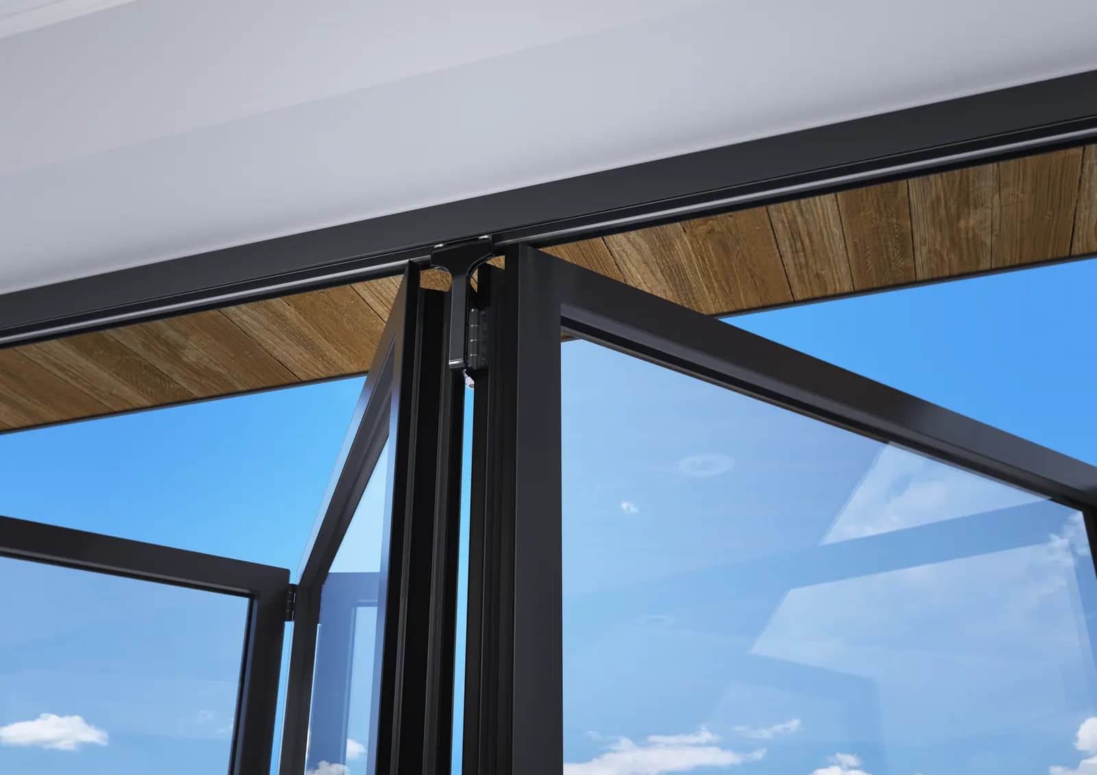 The top corner of an open bifold sash against a timber soffit and blue sky