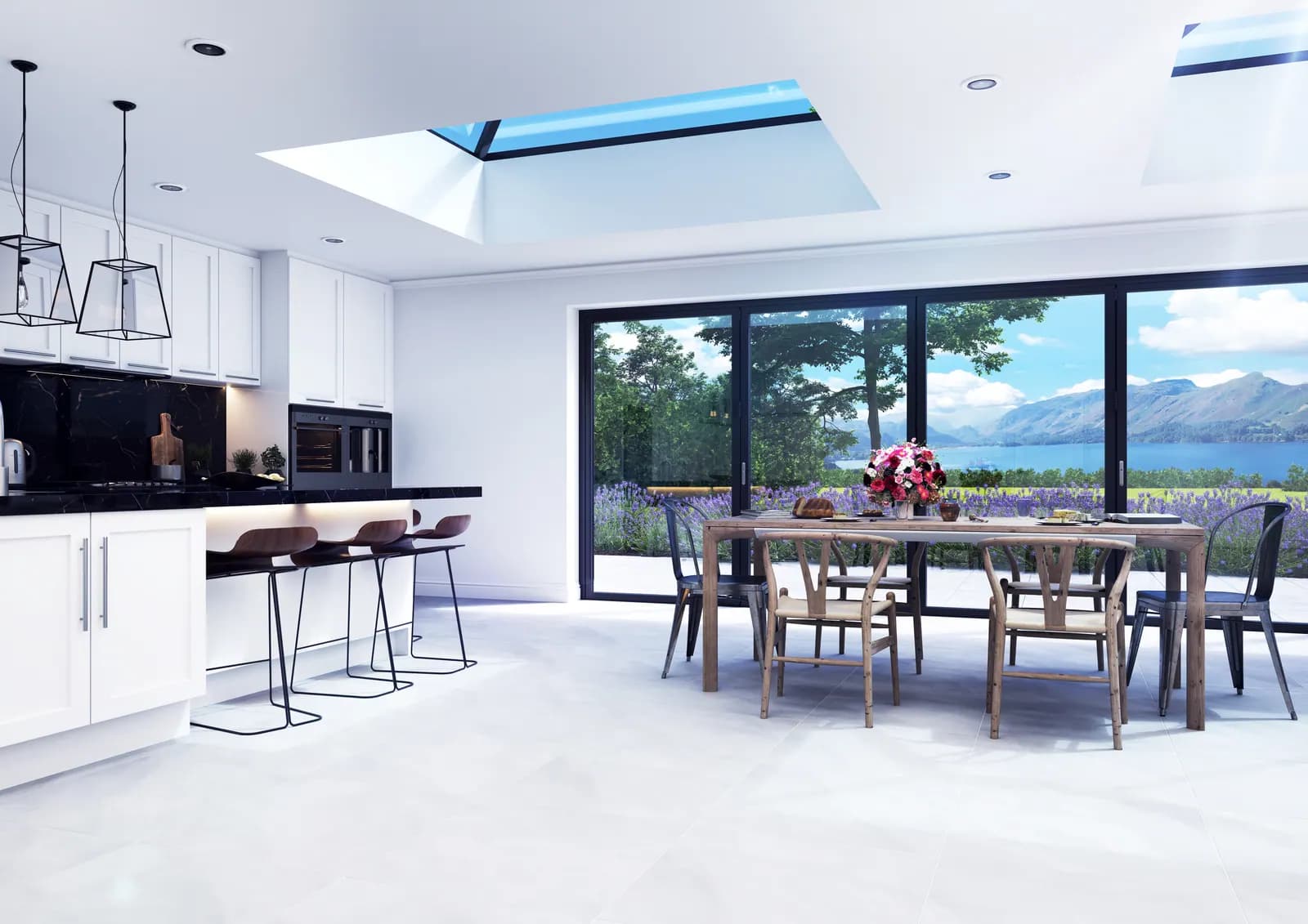 An open plan kitchen and dining room lit from above, with bifolds along one wall