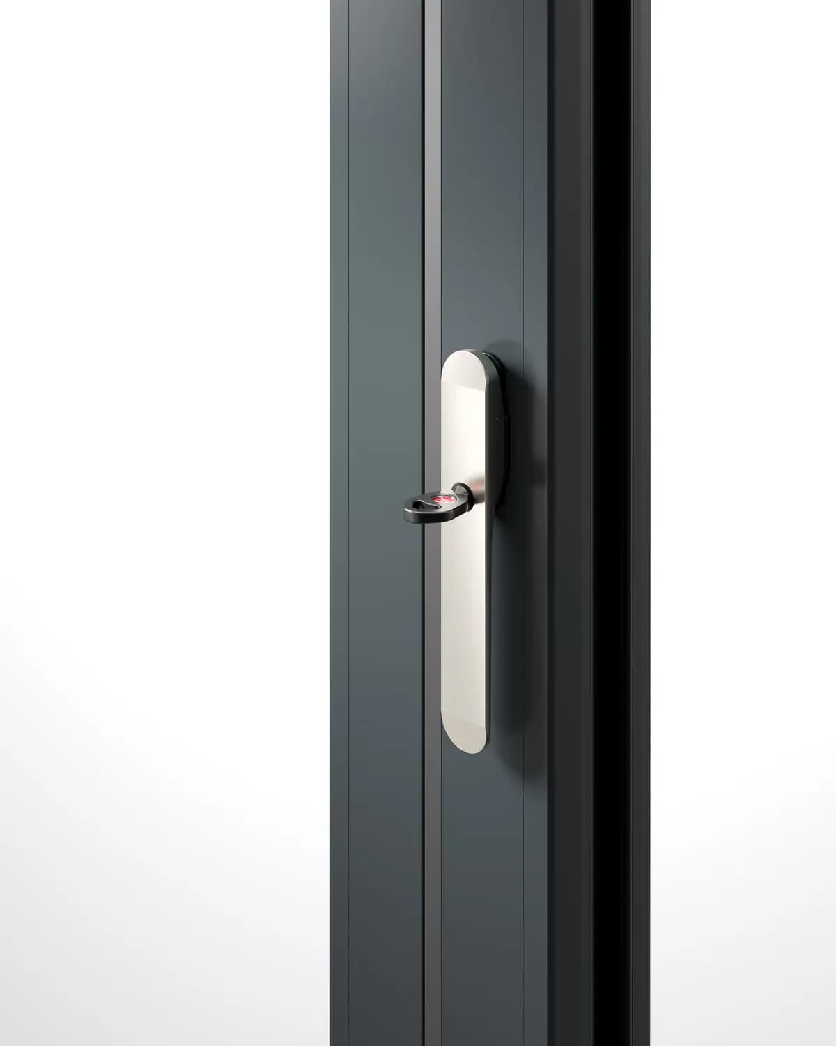 A slim brushed handle set into the stile of an anthracite bifold sash, key in the lock